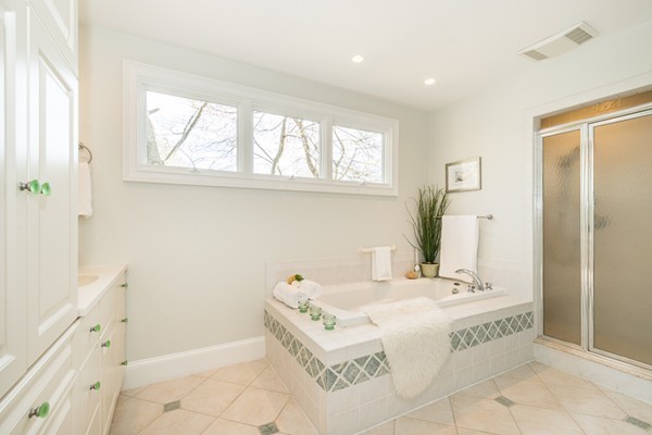 11 Oakland Street Lexington, MA 02420 - Photo 23 of 30 a spacious bathroom with a tub sink and mirror