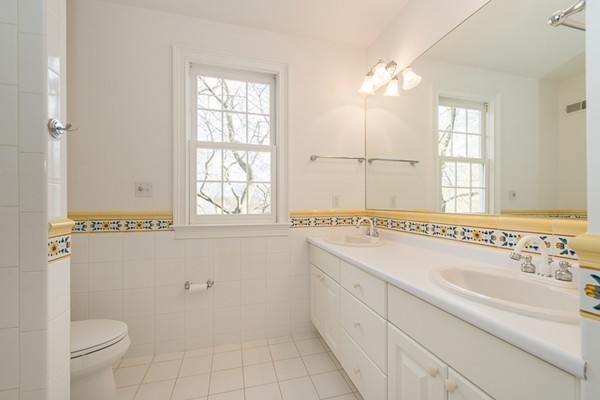 11 Oakland Street Lexington, MA 02420 - Photo 24 of 30 a bathroom with a sink toilet and shower