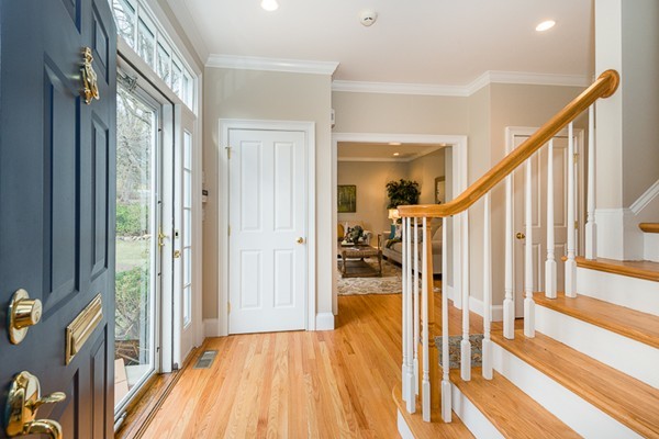 11 Oakland Street Lexington, MA 02420 - Photo 3 of 30 a view of a hallway with wooden floor and staircase