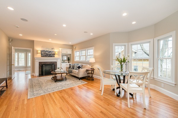 11 Oakland Street Lexington, MA 02420 - Photo 9 of 30 a living room with furniture a fireplace and wooden floor