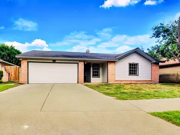 a house with yard in front of it