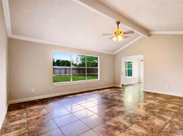 a view of an empty room with a window