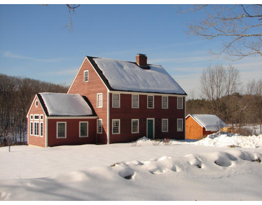6 Adams Road North Brookfield, MA 01535 - Photo 2 of 19 a front view of a house with a yard covered in snow