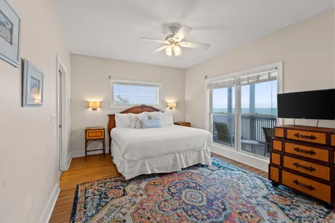 a bedroom with a bed and flat screen tv