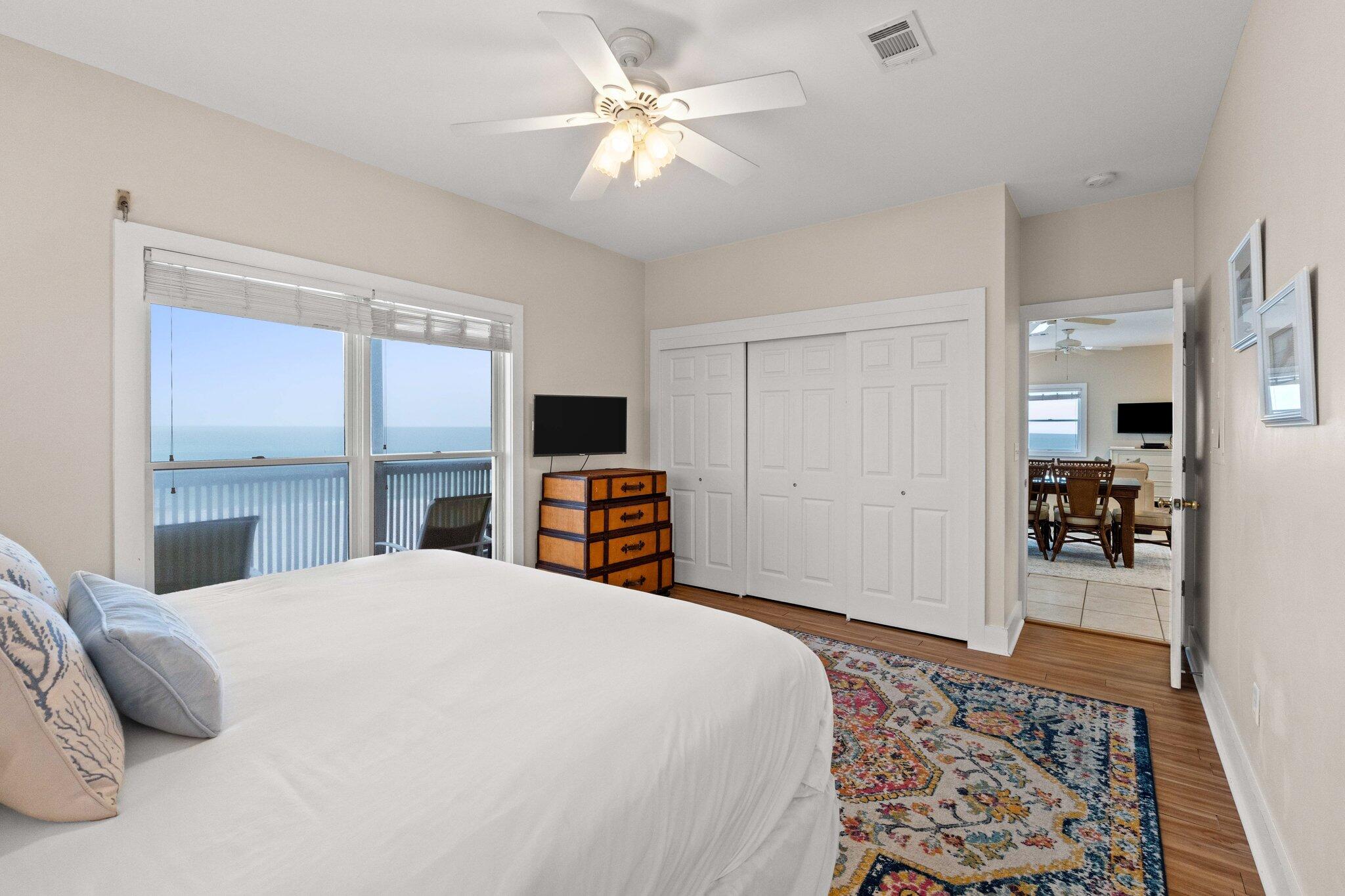 17 Fort Panic Road Santa Rosa Beach, FL 32459 - Photo 13 of 19 a bedroom with a large bed and a chandelier
