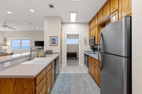 a kitchen with a refrigerator a sink and dishwasher