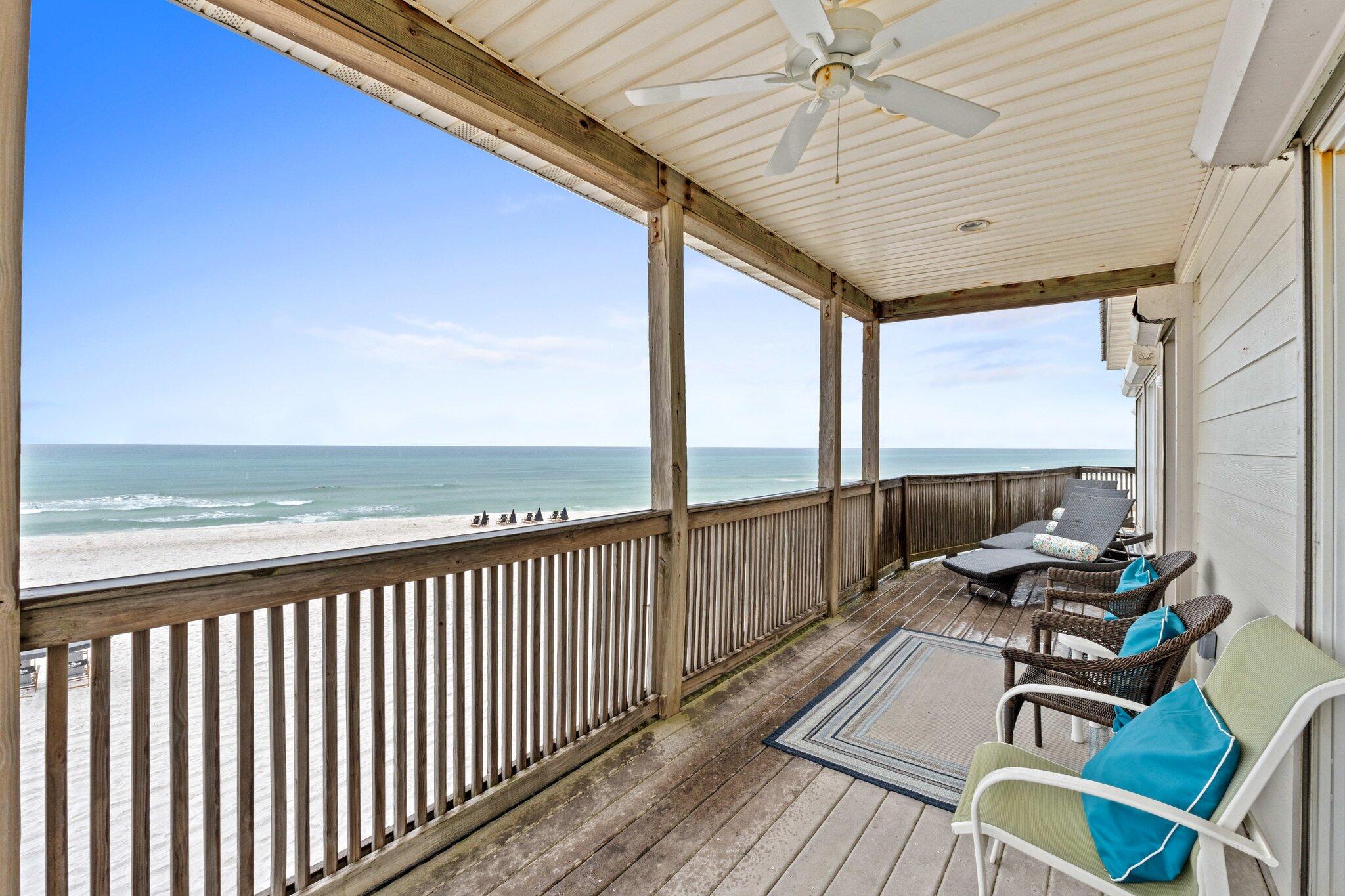 17 Fort Panic Road Santa Rosa Beach, FL 32459 - Photo 9 of 19 a balcony with wooden floor table and chairs