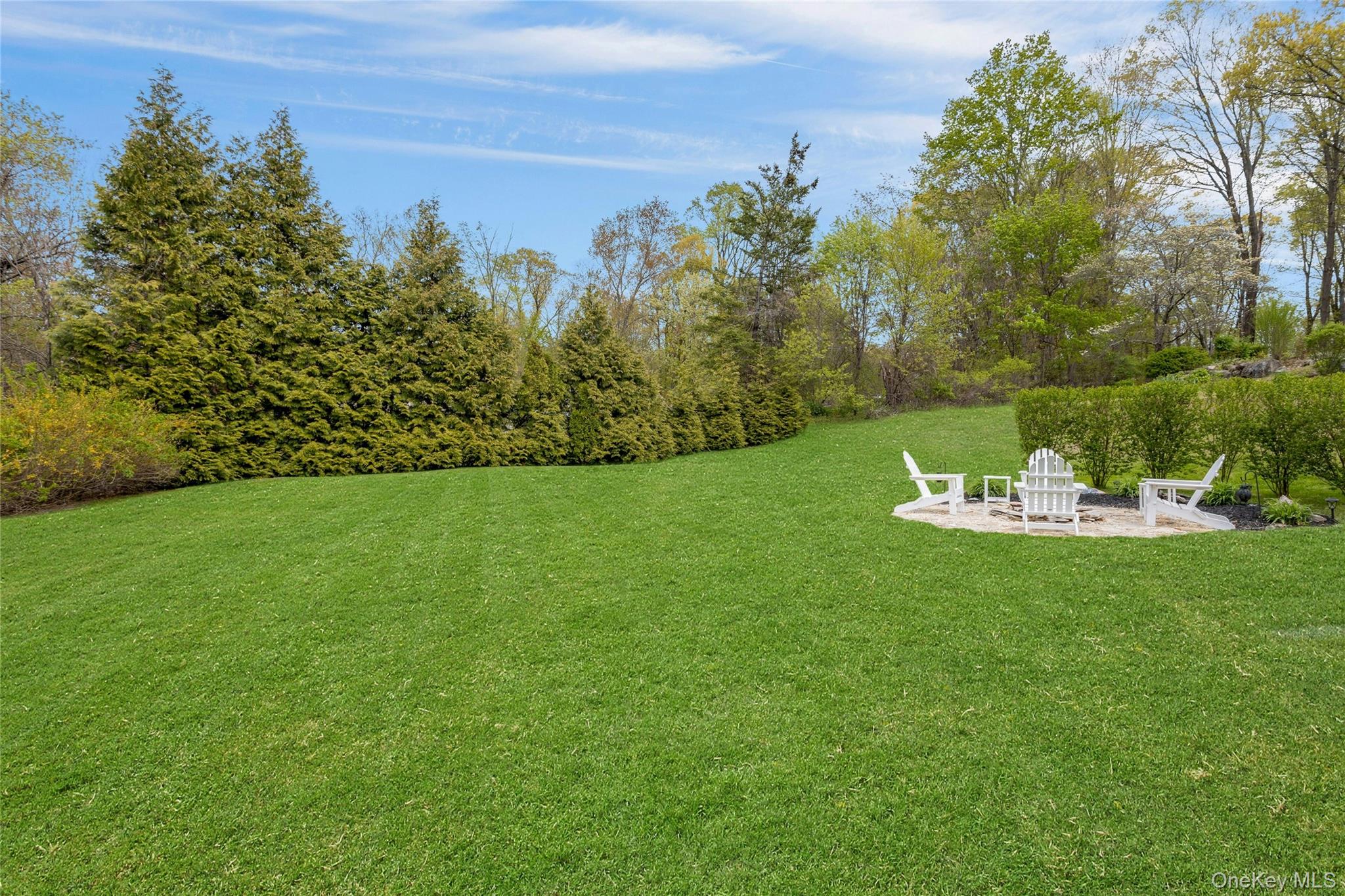 340 Osceola Road Jefferson Valley, NY 10535 - Photo 35 of 48 a view of a table and chairs in the garden