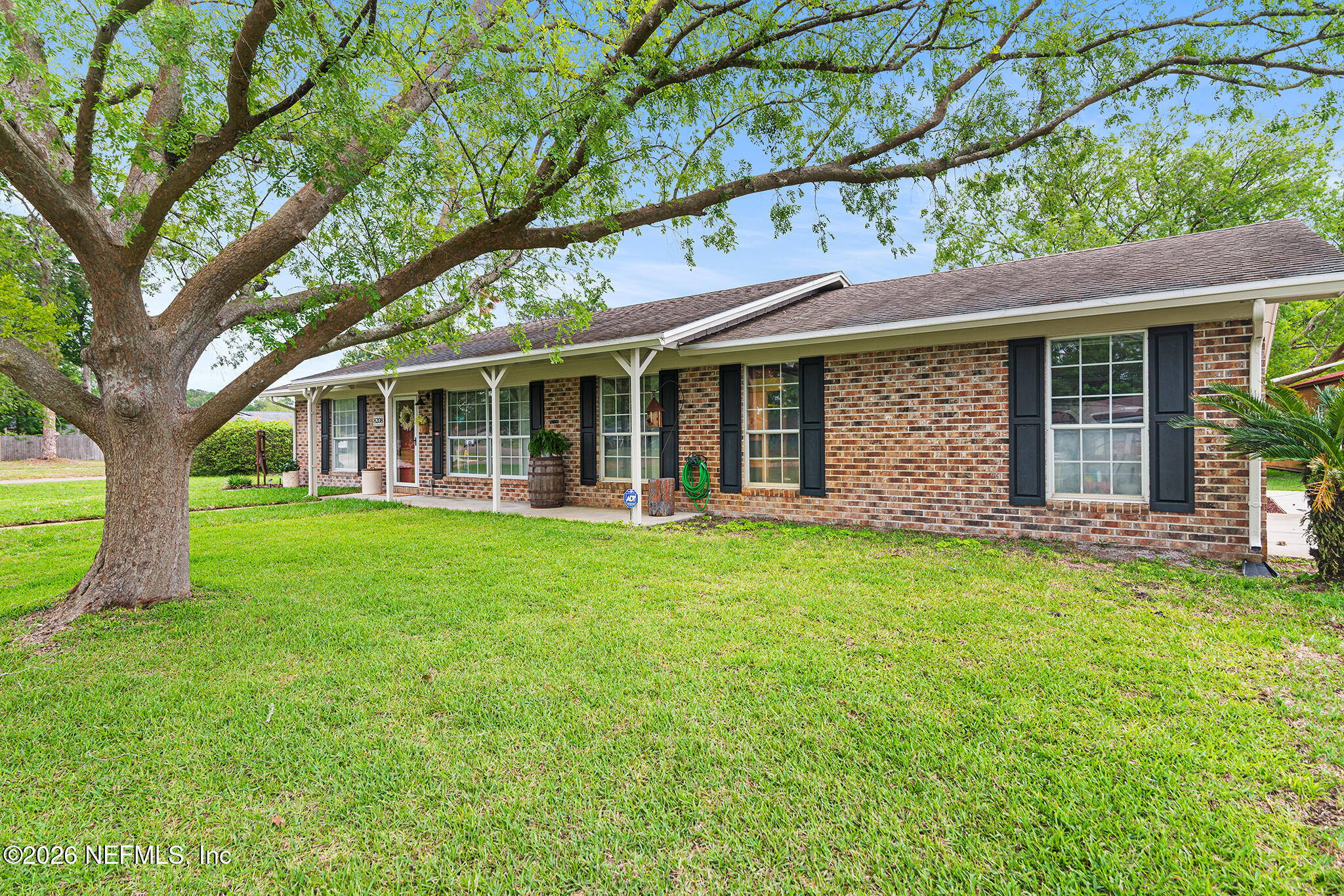front view of a house with a yard