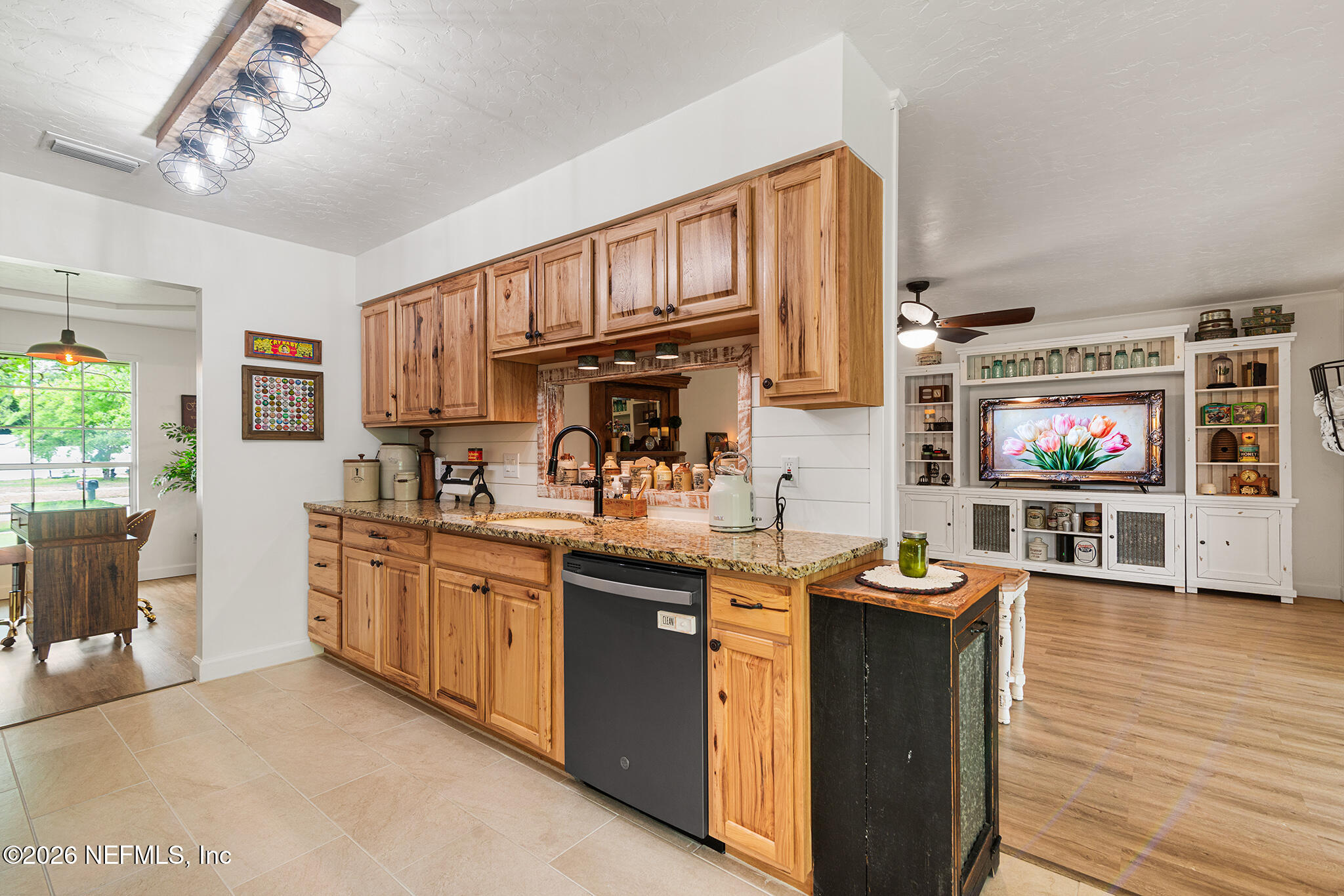 8208 Worm Wood Road Jacksonville, FL 32210 - Photo 16 of 35 a kitchen with stainless steel appliances granite countertop a stove and a sink
