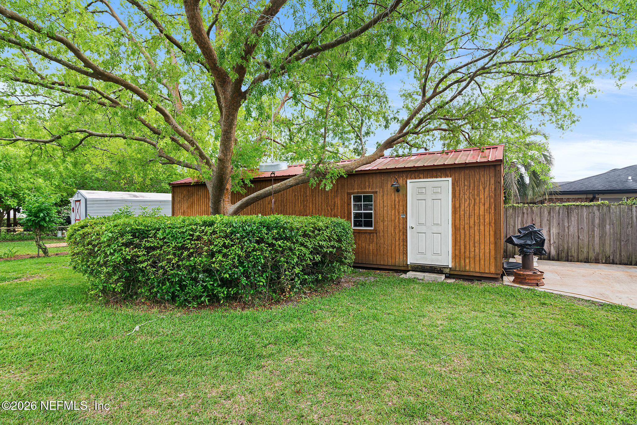 8208 Worm Wood Road Jacksonville, FL 32210 - Photo 32 of 35 a front view of a house with a yard and trees