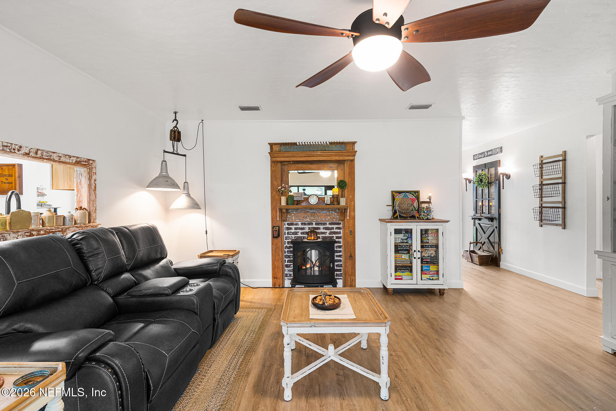 8208 Worm Wood Road Jacksonville, FL 32210 - Photo 9 of 35 a living room with furniture and wooden floor