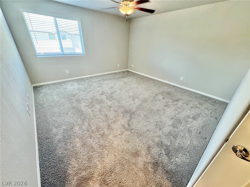 7020 Colonial Ranch Street Las Vegas, NV 89166 - Photo 6 of 37 Plush carpeting and neutral walls define this comfortable bedroom space.