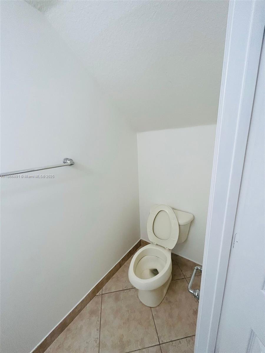 22129 Majestic Woods Way, Unit 504 Boca Raton, FL 33428 - Photo 12 of 23 a bathroom with a toilet