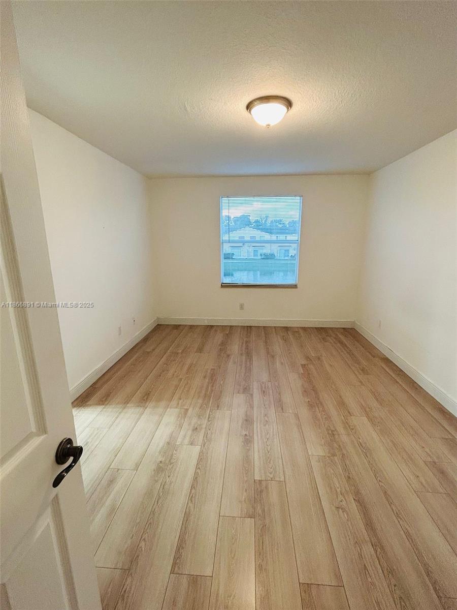 22129 Majestic Woods Way, Unit 504 Boca Raton, FL 33428 - Photo 20 of 23 wooden floor in a room