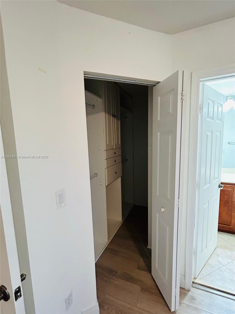22129 Majestic Woods Way, Unit 504 Boca Raton, FL 33428 - Photo 22 of 23 a view of hallway with wooden floor