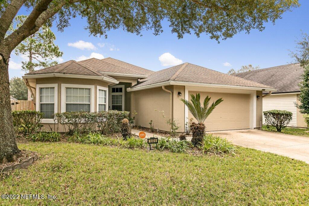 1509 Cotton Clover Drive Orange Park, FL 32065 - Photo 1 of 21 front view of house with a yard