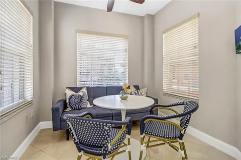 a living room with furniture a window and a table