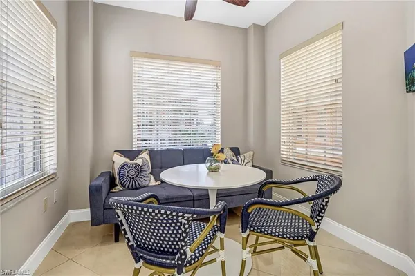 a living room with furniture a window and a table