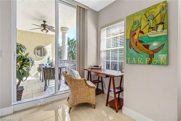 a dining room with furniture and a window
