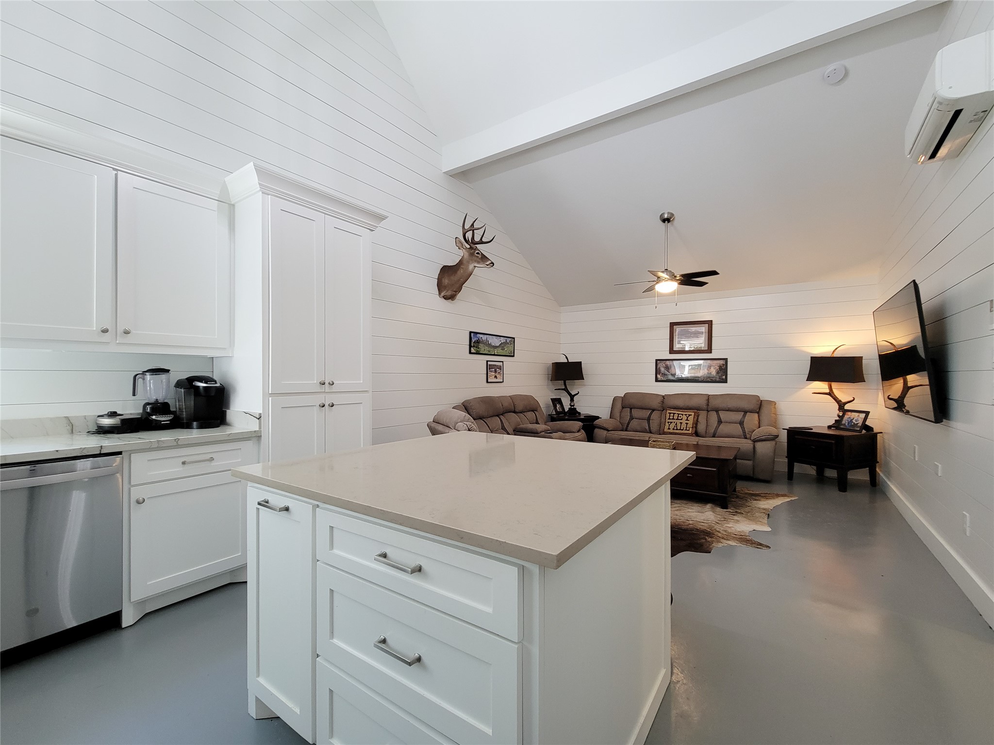 4937 Wolff Road Round Top, TX 78954 - Photo 11 of 31 This kitchen features an island for effortless cooking and a barstool dining area, perfect for casual meals.
