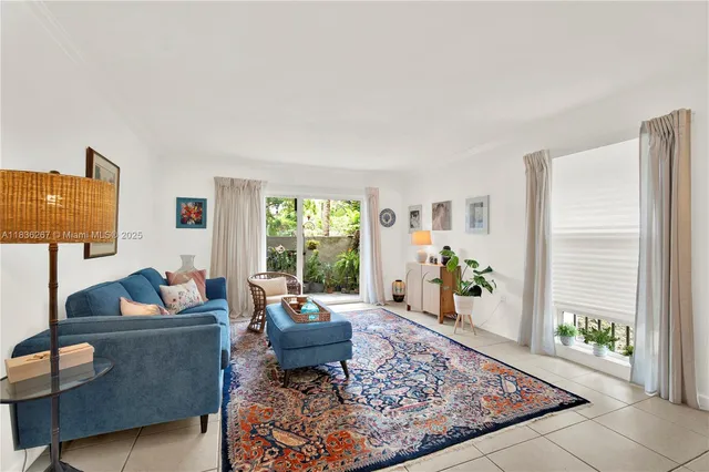 a living room with furniture and a rug