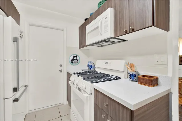 a kitchen with a stove and a sink