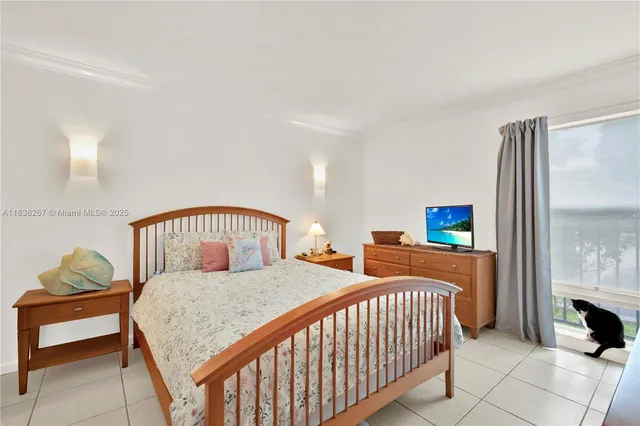 a bedroom with a bed and a table in it