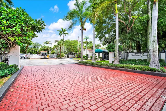 a view of a house with swimming pool and sitting area