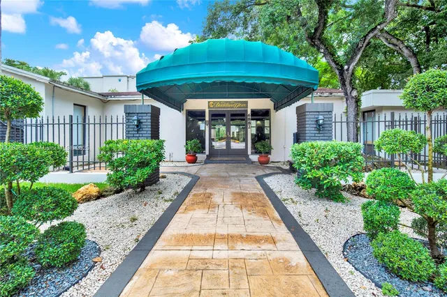 an outdoor space with furniture and umbrella