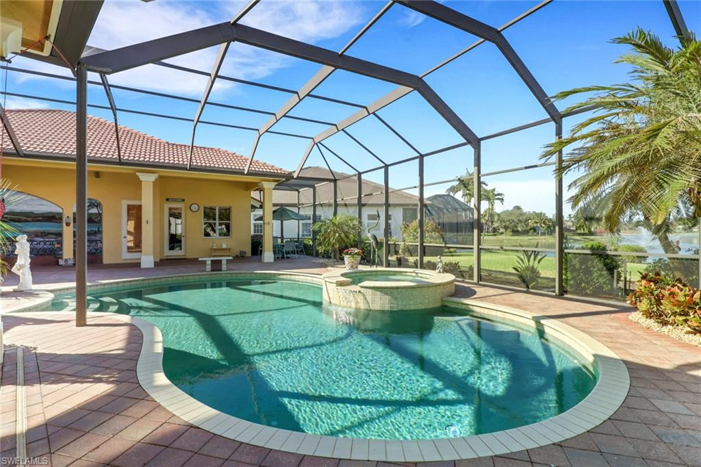 435 Terracina Way Naples, FL 34119 - Photo 32 of 50 View of swimming pool with a sunroom, a patio, a lanai, and a pool with connected hot tub