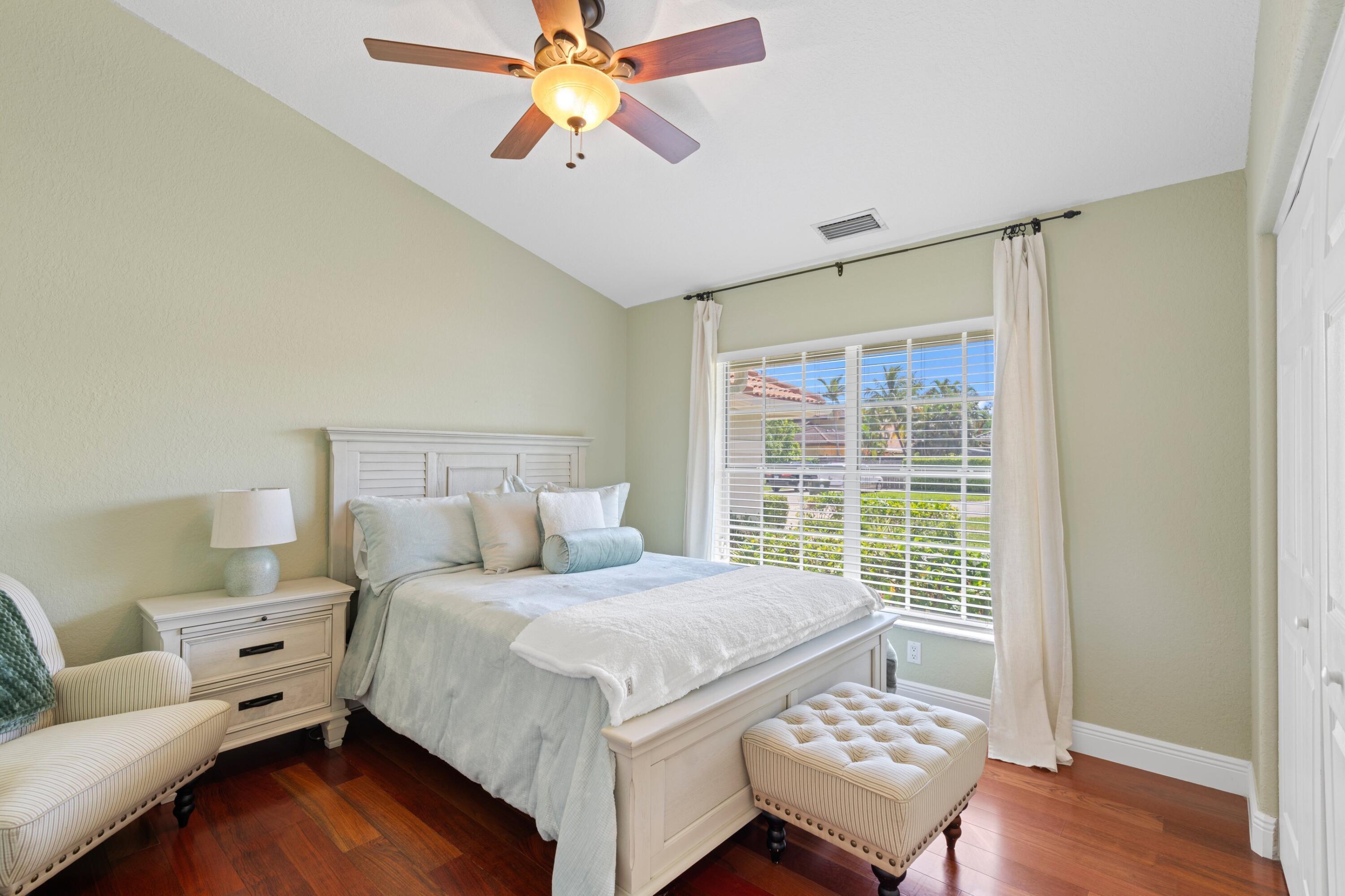 7598 Fairway Trail Boca Raton, FL 33487 - Photo 13 of 50 a bedroom with a bed and a window
