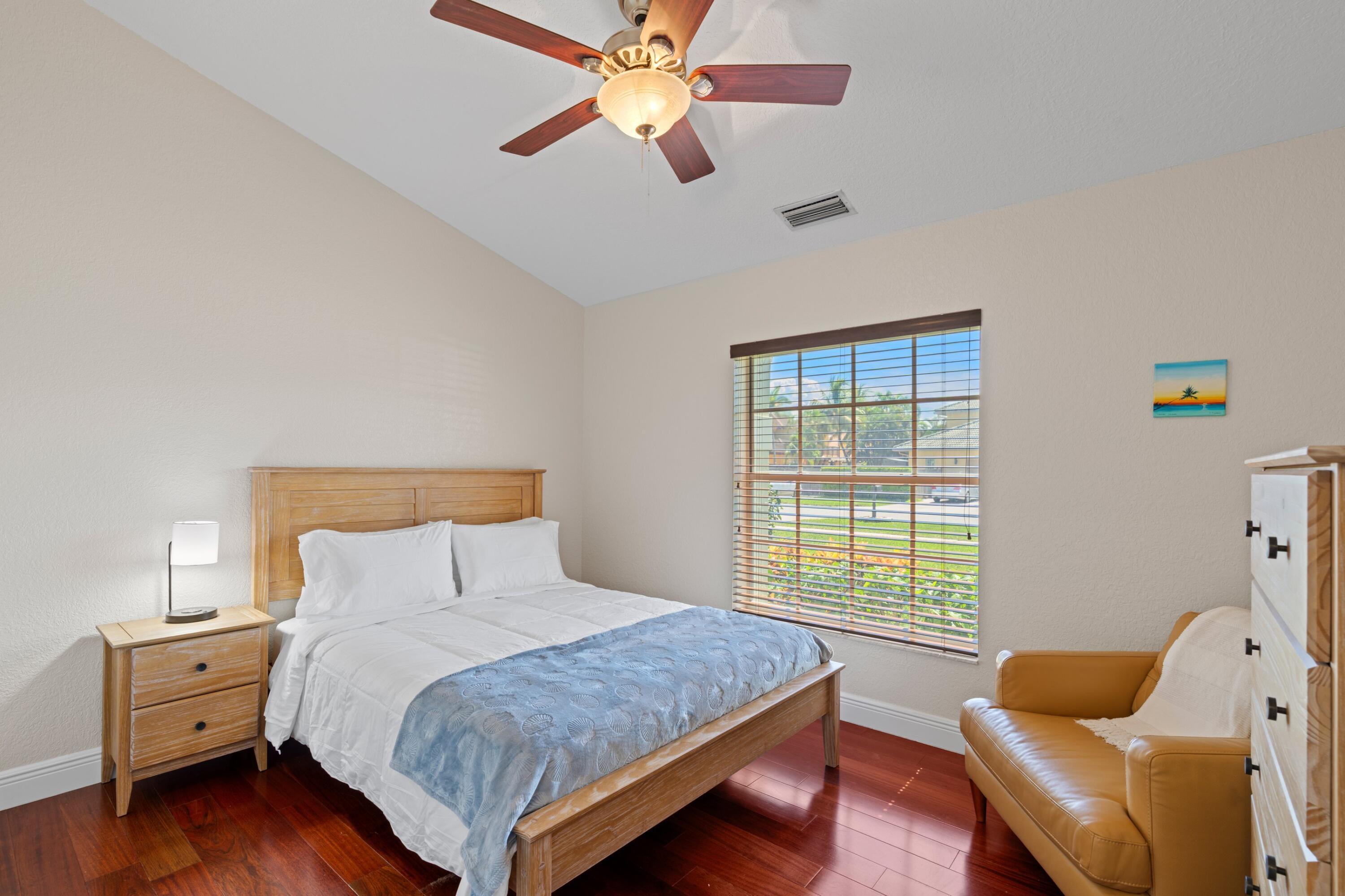 7598 Fairway Trail Boca Raton, FL 33487 - Photo 15 of 50 a bedroom with a bed and a couch