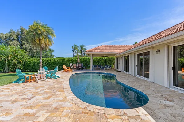 a view of a swimming pool with a patio