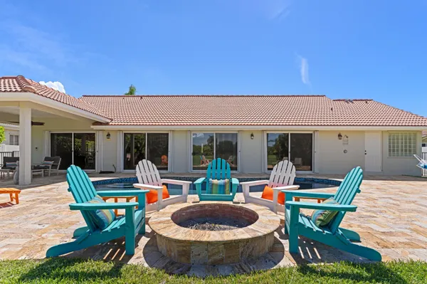 a outdoor space with furniture a flat screen tv
