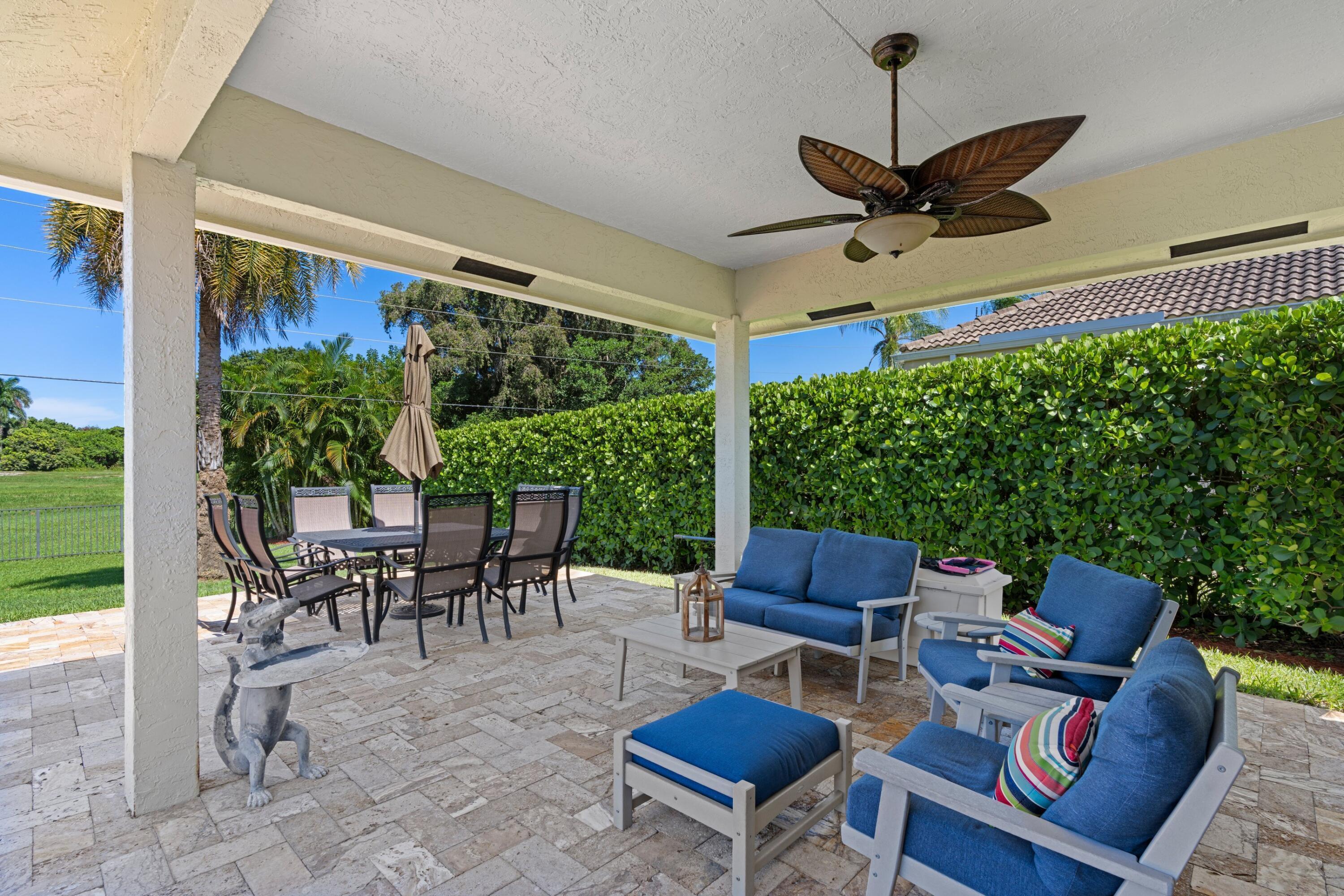 7598 Fairway Trail Boca Raton, FL 33487 - Photo 23 of 50 a outdoor space with furniture a flat screen tv