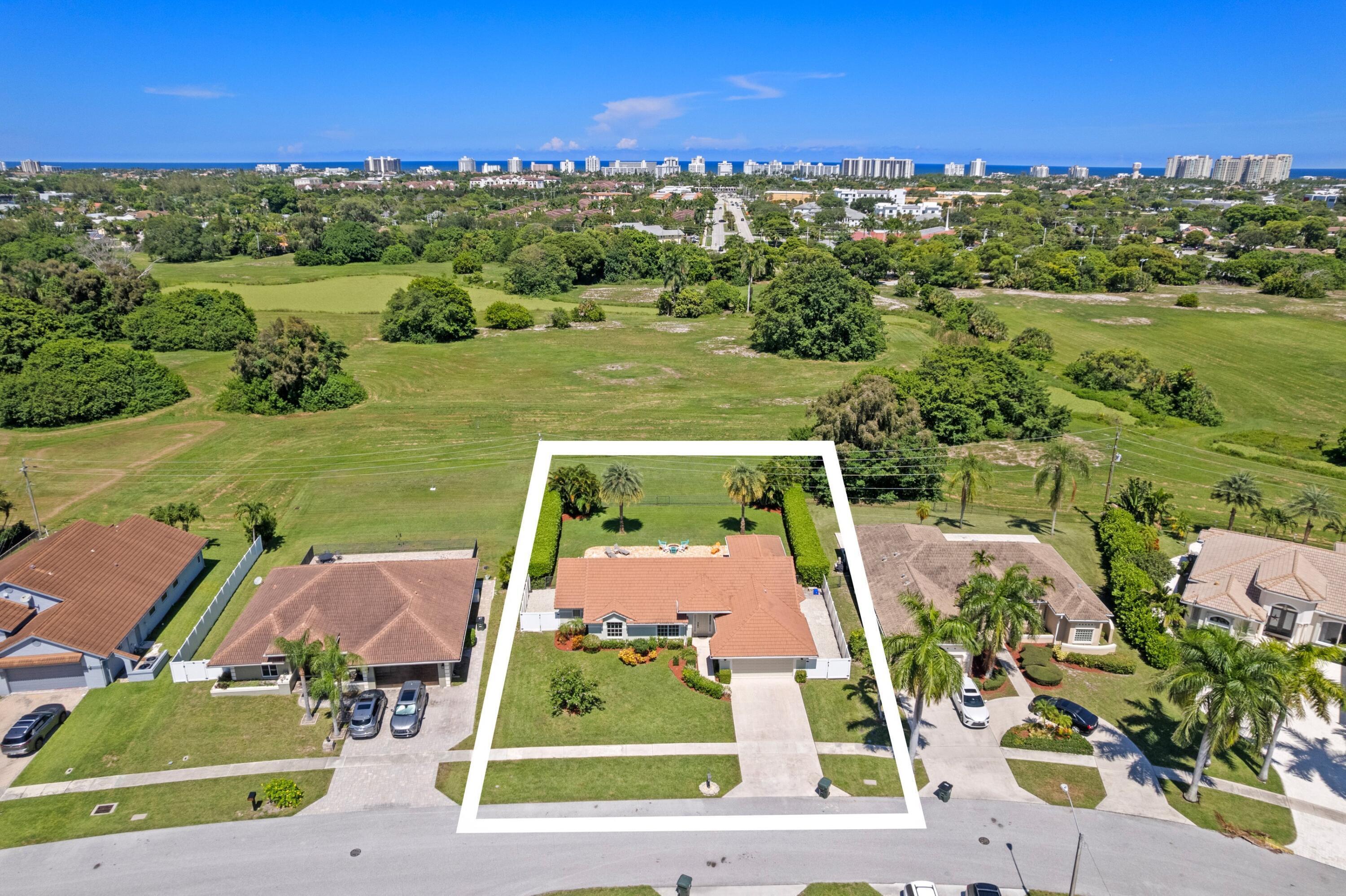 7598 Fairway Trail Boca Raton, FL 33487 - Photo 29 of 50 an aerial view of residential houses with outdoor space and street view