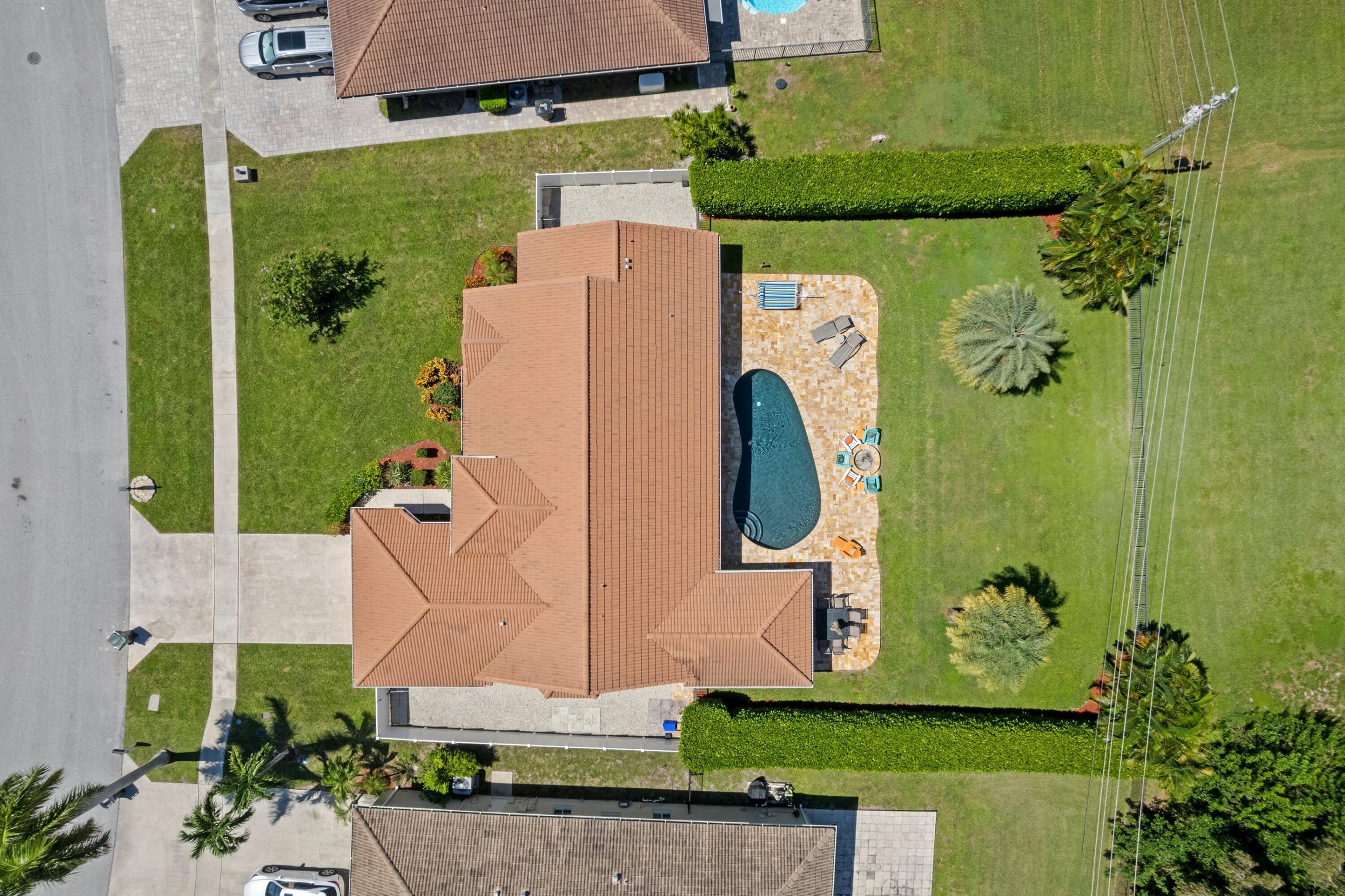 7598 Fairway Trail Boca Raton, FL 33487 - Photo 3 of 50 an aerial view of a house with a swimming pool