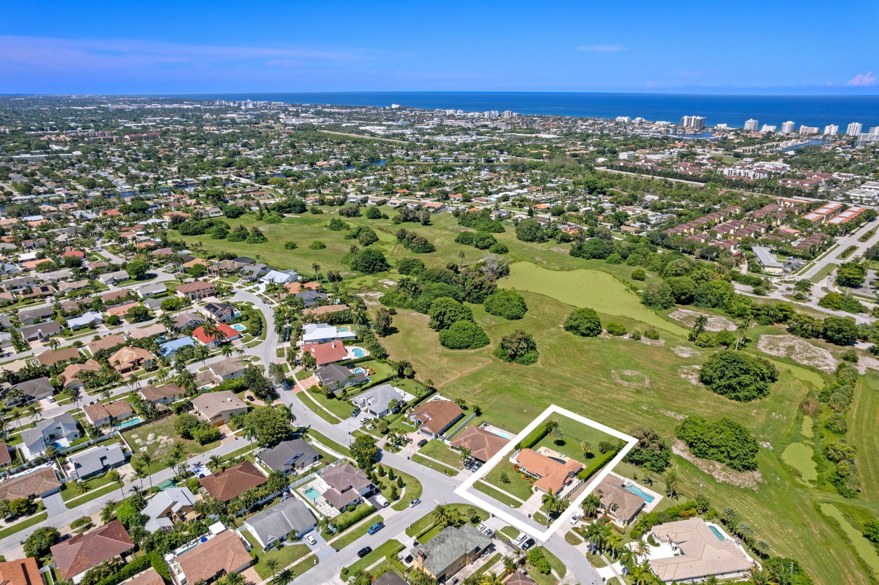7598 Fairway Trail Boca Raton, FL 33487 - Photo 32 of 50 a view of a city with an ocean