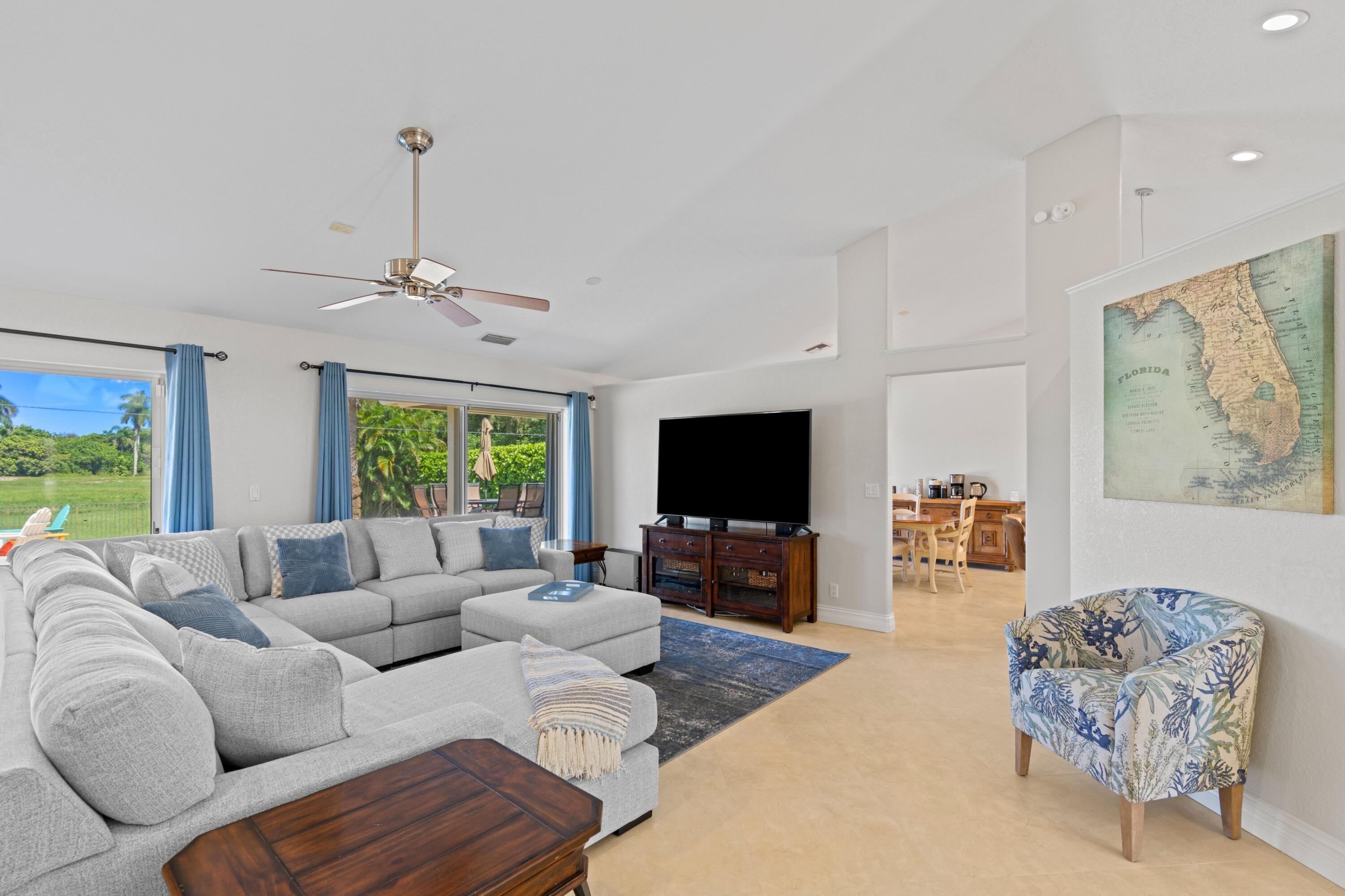 7598 Fairway Trail Boca Raton, FL 33487 - Photo 6 of 50 a living room with furniture and a flat screen tv