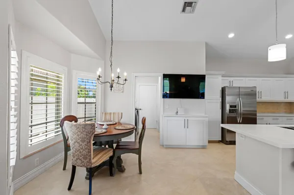 a view of a dining room with furniture window and outside view