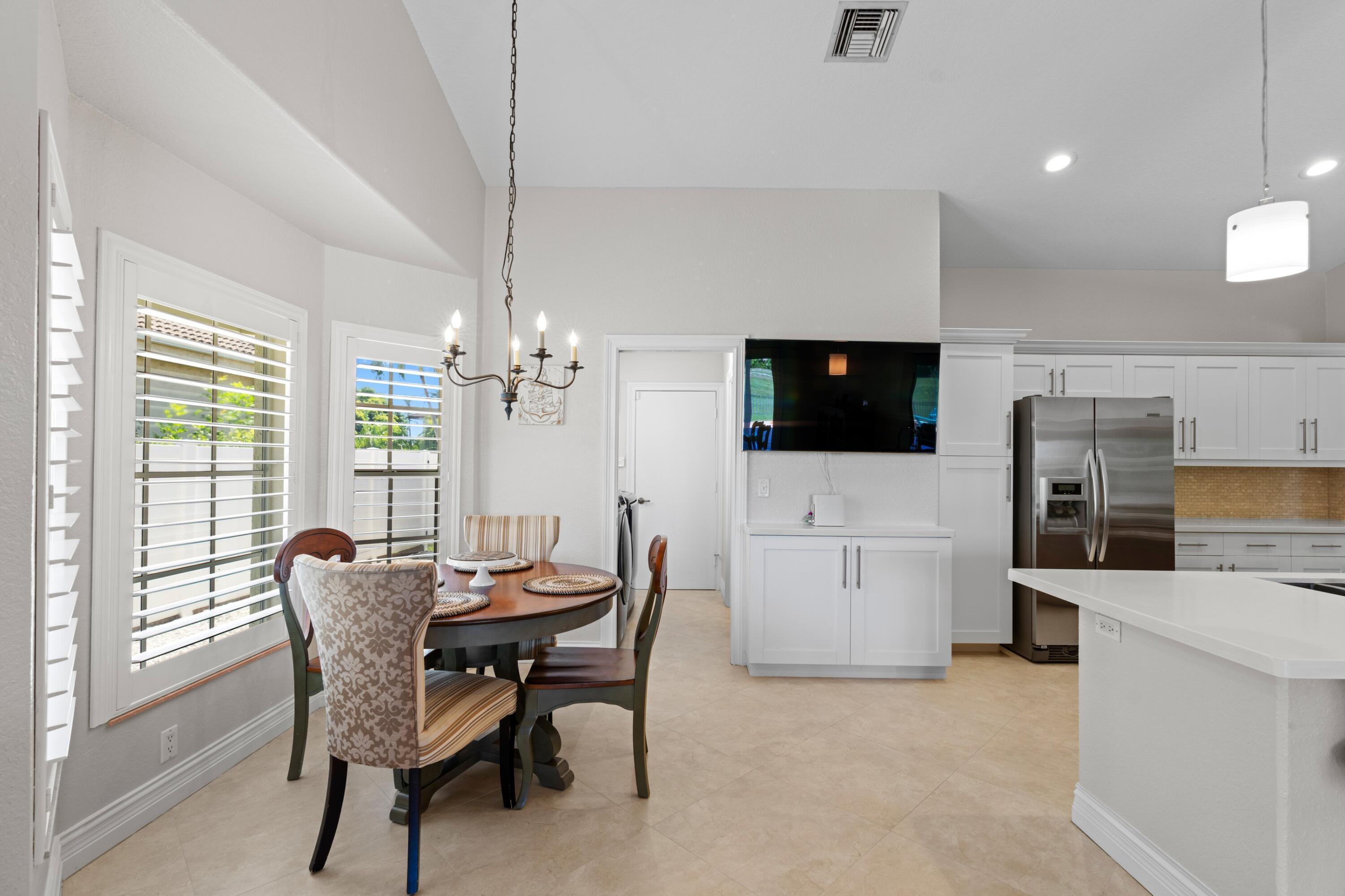 7598 Fairway Trail Boca Raton, FL 33487 - Photo 9 of 50 a dining room with furniture and window