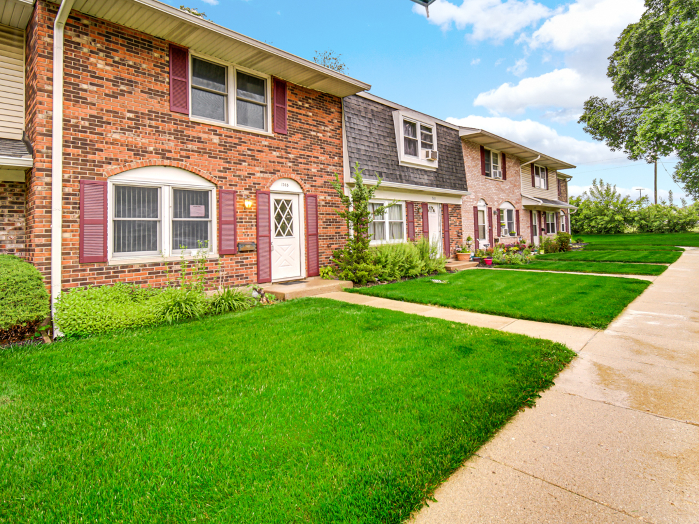 1765 Short Avenue Streamwood, IL 60107 - Photo 2 of 18 a front view of a house with garden
