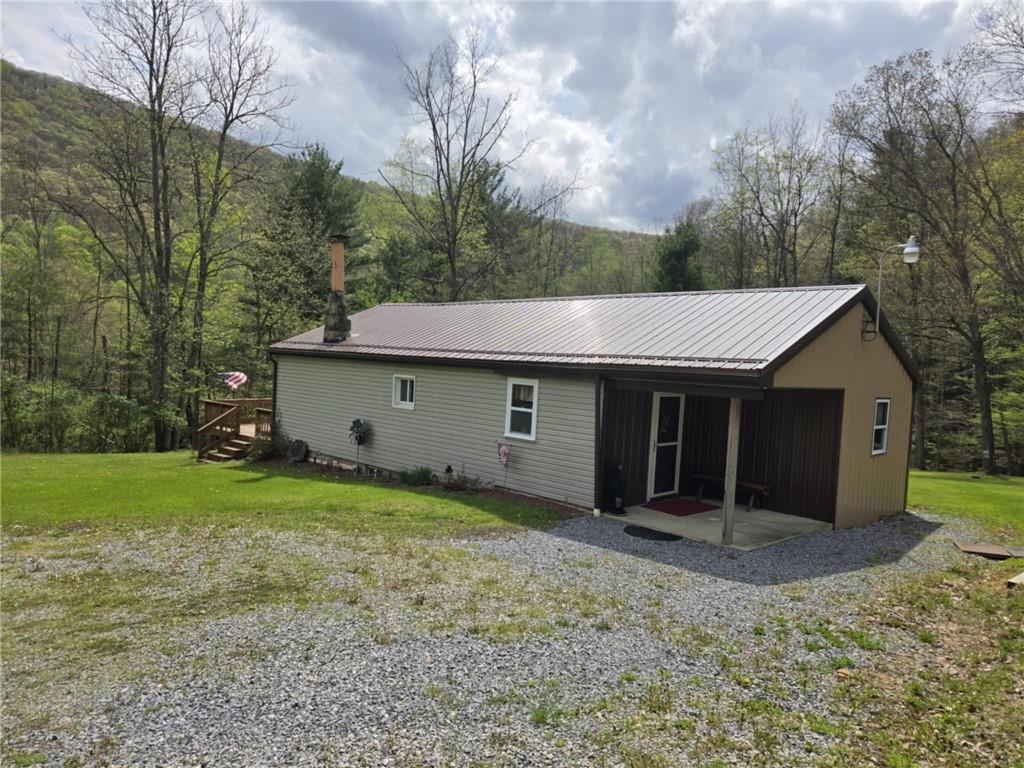 23 Rock Hill Road Weedville, PA 15868 - Photo 17 of 35 a view of a house with a yard and large tree