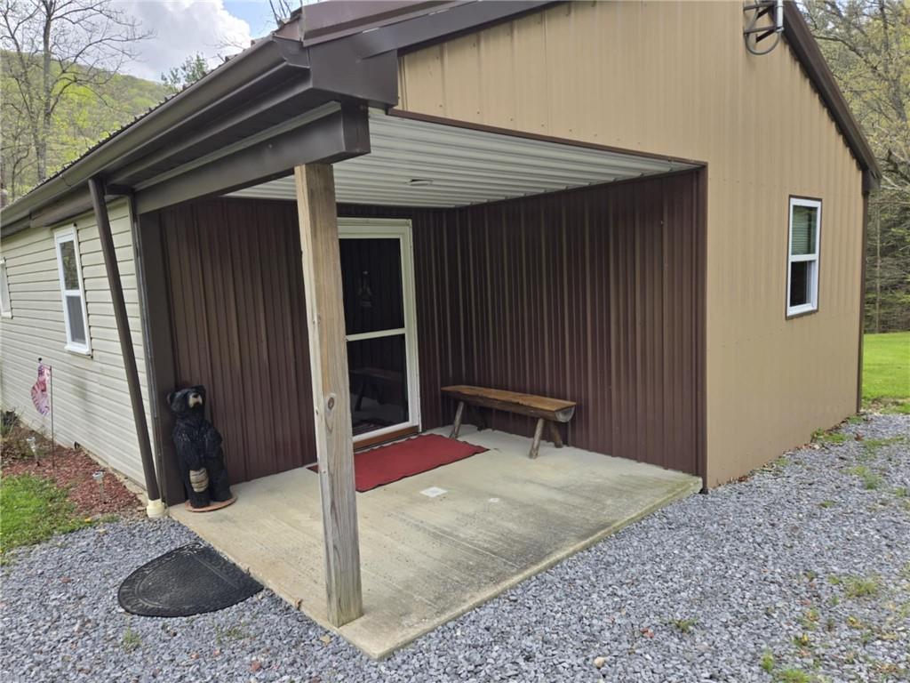 23 Rock Hill Road Weedville, PA 15868 - Photo 18 of 35 a backyard of a house with seating space