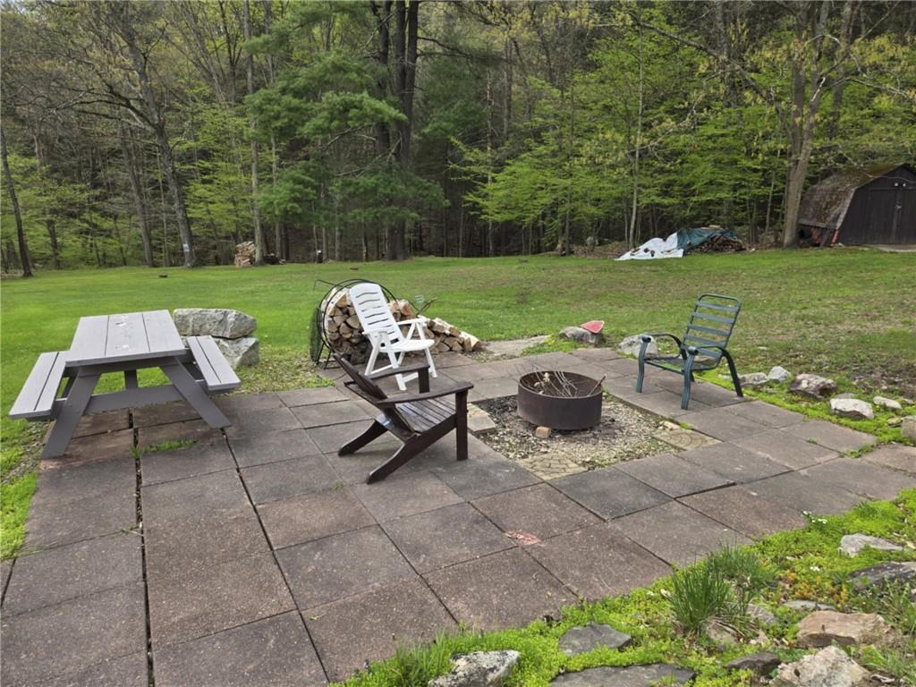 23 Rock Hill Road Weedville, PA 15868 - Photo 19 of 35 a view of a patio with table and chairs and potted plants