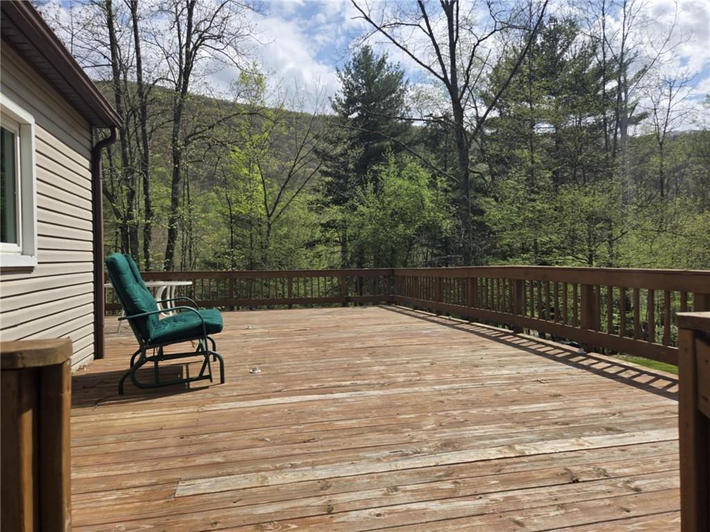 23 Rock Hill Road Weedville, PA 15868 - Photo 34 of 35 a wooden bench sitting on top of a wooden floor
