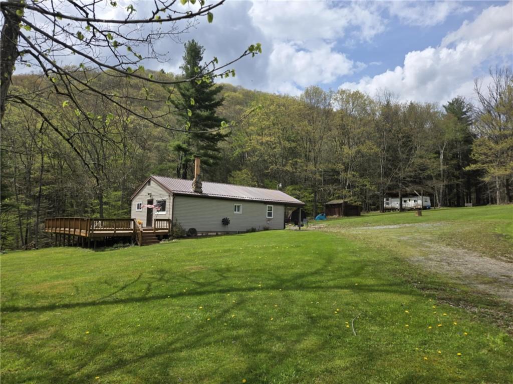 23 Rock Hill Road Weedville, PA 15868 - Photo 35 of 35 a house that is sitting in the grass with large trees