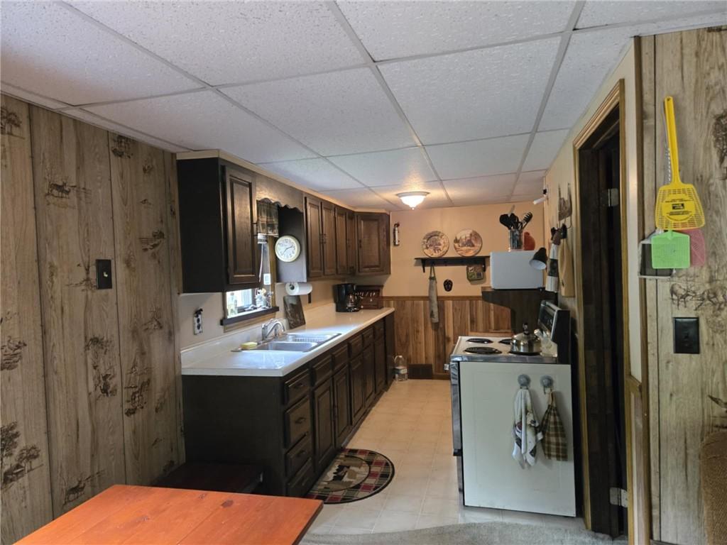 23 Rock Hill Road Weedville, PA 15868 - Photo 7 of 35 a kitchen with stainless steel appliances kitchen island granite countertop a refrigerator and a sink