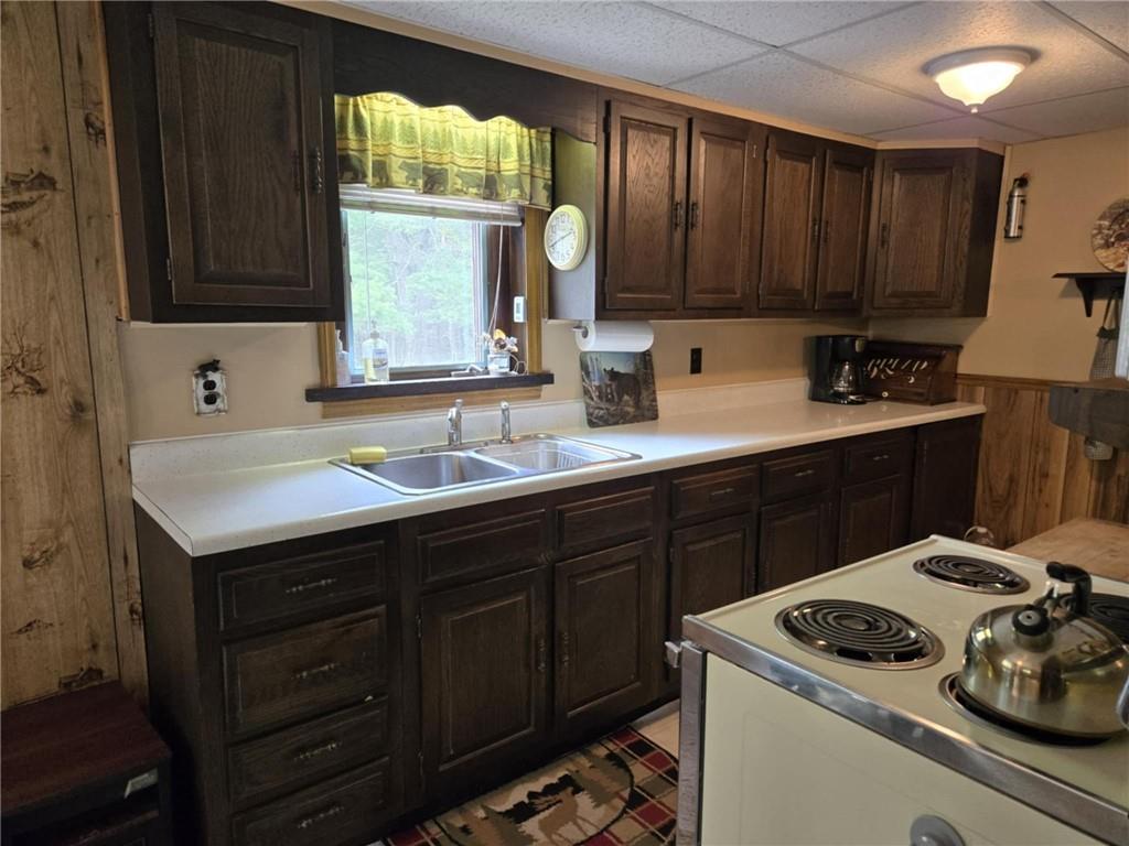 23 Rock Hill Road Weedville, PA 15868 - Photo 9 of 35 a kitchen with a sink a stove and cabinets